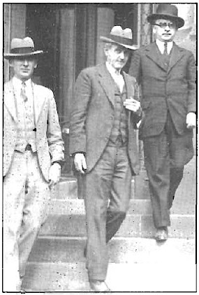 Three men with hat. One of them is Chief Deputy Patrick Pyne