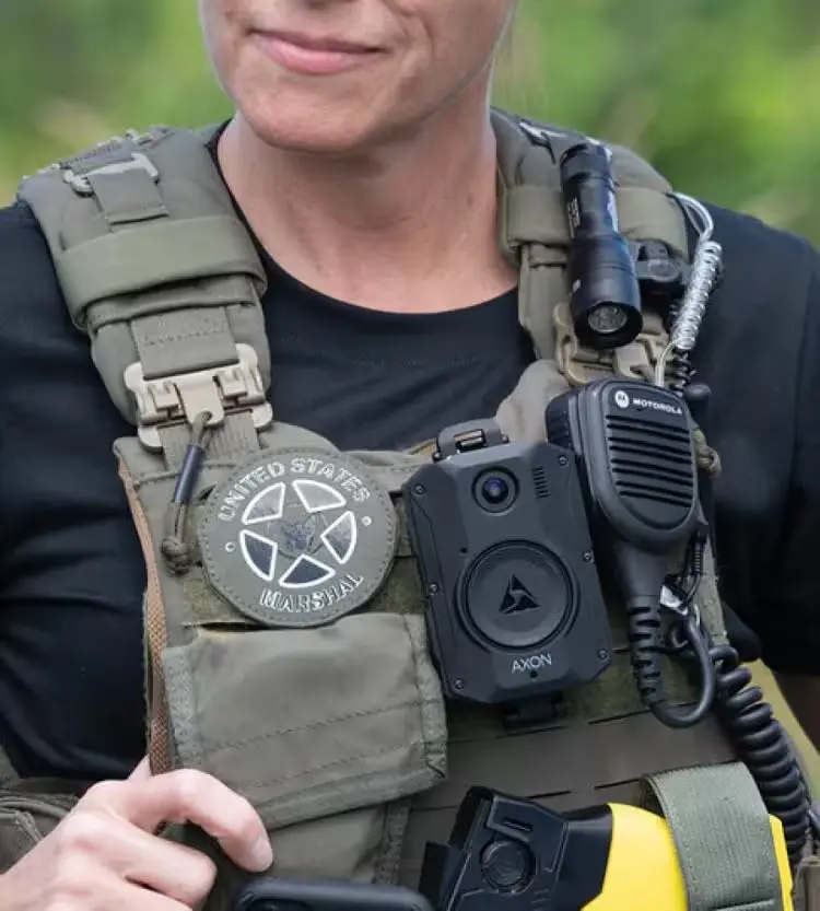 Female Deputy Marshal wearing Vest with Body Worn Camera