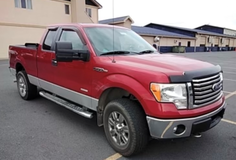 Fugitive Isaiah Robert Tilghman - Red Ford Truck