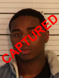 Face phot of male fugitive Justin Johnson - Captured