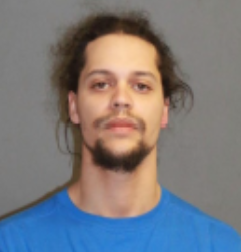 Face photo of male fugitive Eric Jeffry Roman