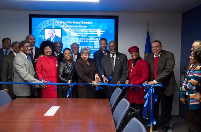 Mr. Bowden cutting the ribbon to the MSD conference room dedication in his name. 