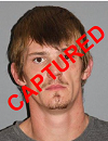 Face photo of captured fugitive Alexander Sutton