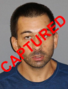 Face photo of the capture fugitive Jason Lee Brewer