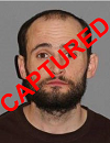 Face photo of captured male fuigitive Shaun Laws