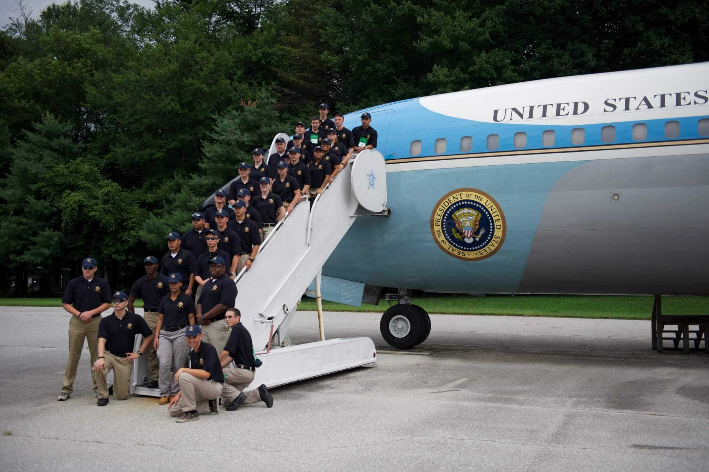 Police officers on an plane stairs