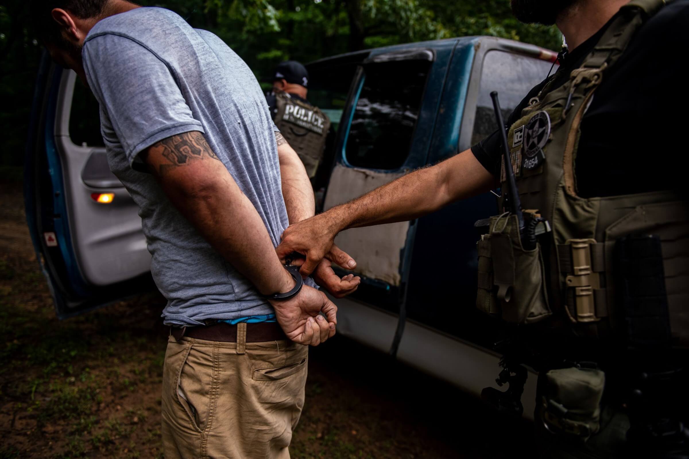 Fugitive hand-cuffed