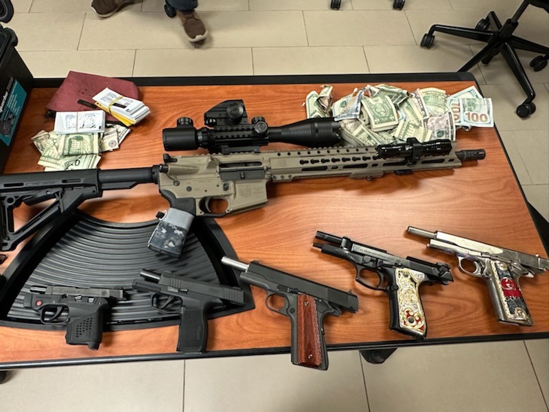 Seized cash and weapons