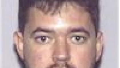 Face photo of male fugitive Julio Antonio Lopez