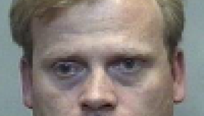 Face photo of male fugitive John Kenneth Capps