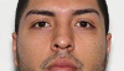 Face photo of a male fugitive Estrada Omar