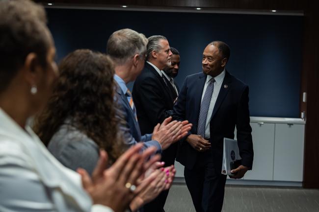 People clapping for former director, Donald Washington