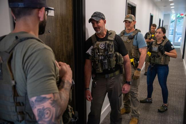 Deputy U.S. Marshals at front door during Operation North…