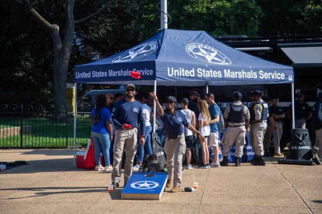 Deputy U.S. Marshals playing cornhole at the 2022 National…
