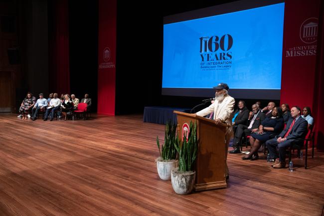 James Meredith speaking to an audience at the University of…