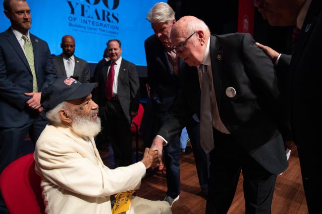 Herschel Garner shaking hands with James Meredith.